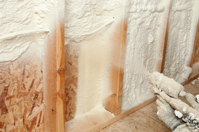 spray foam insulation being installed in a wall